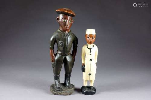 Le Médecin et le Soldat. Deux statuettes en bois s...
