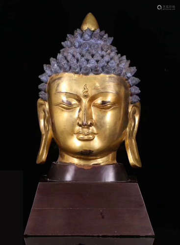 A TIBETAN GILT BRONZE SAKYAMUNI BUDDHA HEAD STATUE