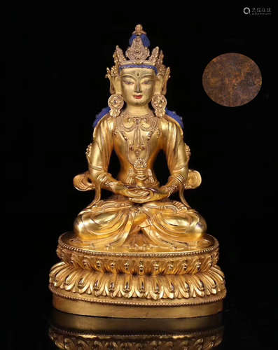 A GILT BRONZE LIFELESS BUDDHA