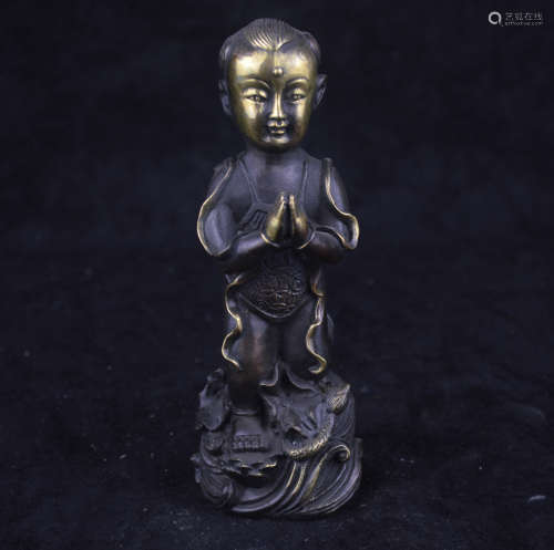 A GILT BRONZE BOY SHAPED FIGURE