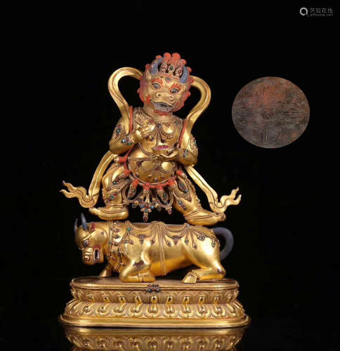 A TIBETAN GILT BRONZE DEMON BUDDHA