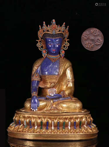 A GILT BRONZE LAZULI DECORATED LIFELESS BUDDHA