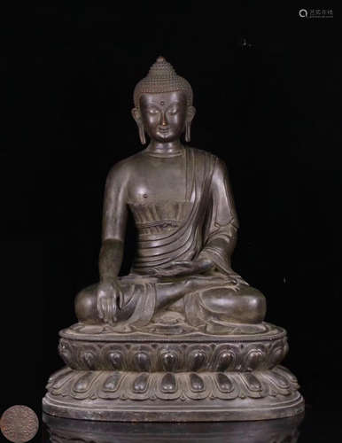 A BRONZE MOLDE SHAKYAMUNI STATUE