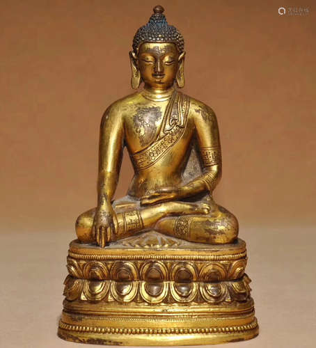 A GILT BRONZE MOLDED BUDDHA STATUE