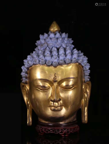 A GILT BRONZE BUDDHA HEAD FIGURE