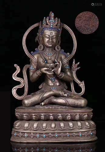 A TIBETAN SILVER CASTED LIFELESS BUDDHA