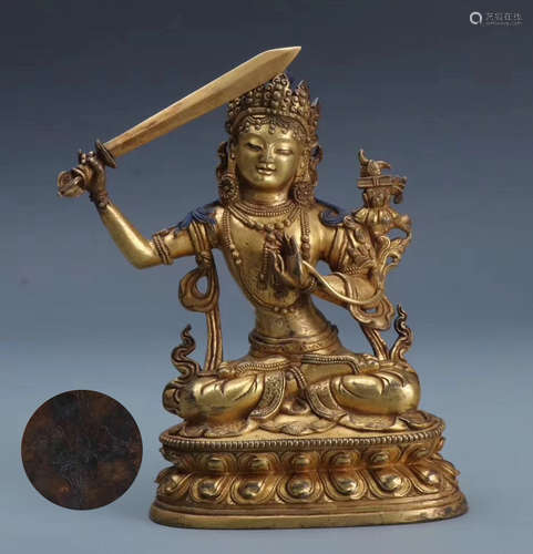 A GILT BRONZE MANJUSHIRI BUDDHA