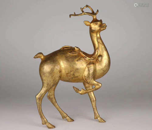 A GILT BRONZE MOLDED DEER SHAPED FIGURE