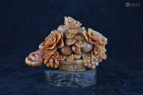 A SOAPSTONE CARVED FLORAL SHAPED ORNAMENT