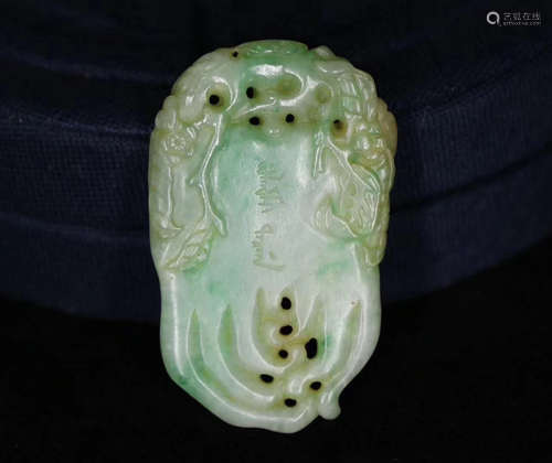 A JADEITE CARVED PENDANT