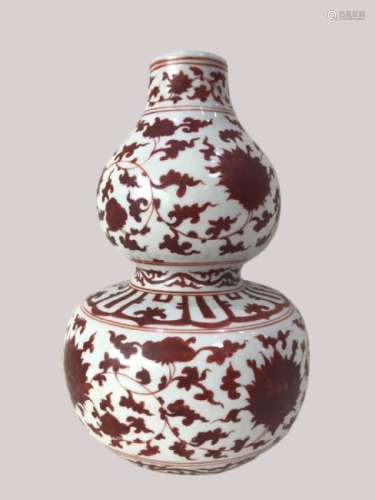 AN IRON RED DOUBLE GOURD VASE , JIAJING PERIOD