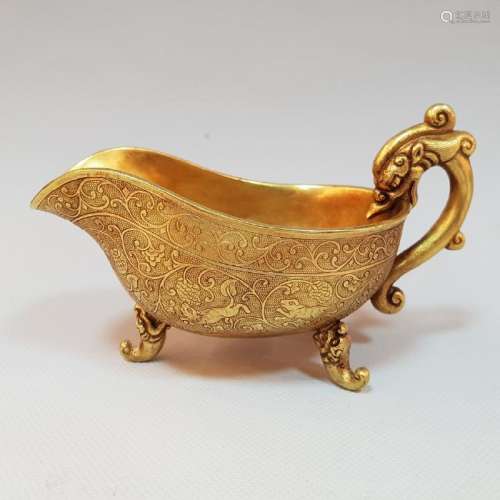 A CARVED GOLD TRIPOD DRAGON CUP ,TANG PERIOD