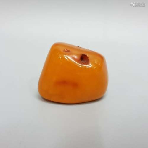 AN AMBER BEAD