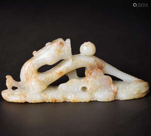 A CARVED WHITE JADE 'DRAGON' PENREST ,QING DYNASTY