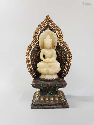 A CARVED WHITE JADE SAKYAMUNI ,QING DYNASTY