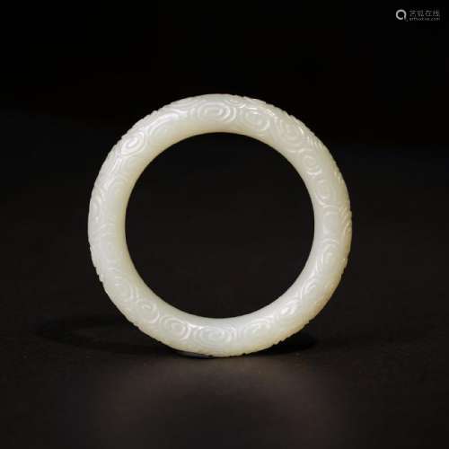A CARVED WHITE JADE BANGLE ,QING DYNASTY