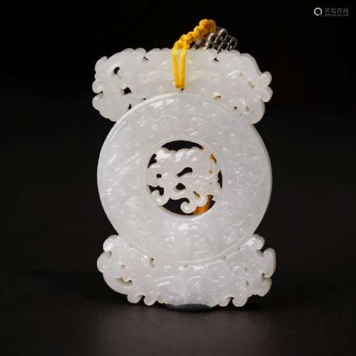 A CARVED WHITE JADE 'DRAGON' PENDANT ,QING DYNASTY