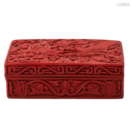 A CHINESE CARVED CINNABAR BOX of rectangular form, the lid and base carved with floral and scrolling