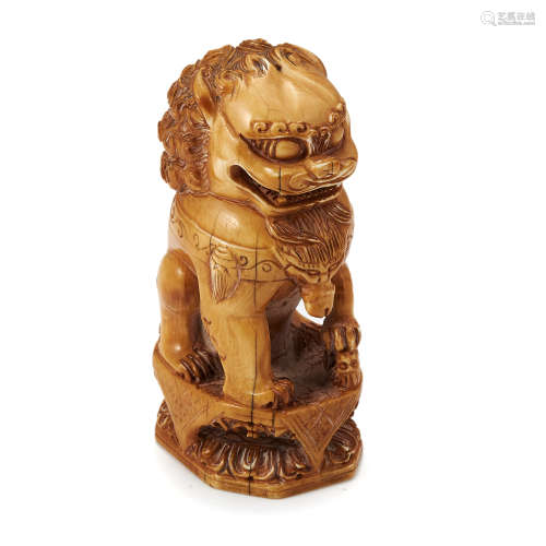 AN ANTIQUE CARVED IVORY SEAL, 19TH CENTURY depicting a seated lion atop a squared base, 10.0cm,