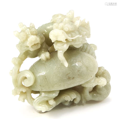 A CHINESE CARVED JADE DRAGON STATUE carved in detail to depict a selection of dragons, 10.2cm,