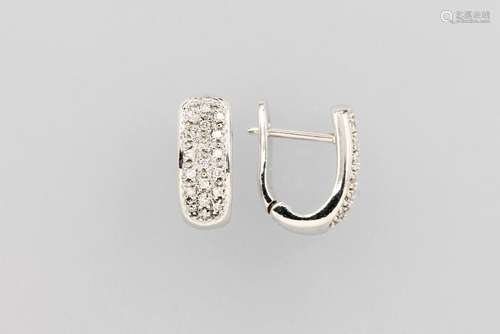 Pair of 14 kt gold hoop earrings with diamonds