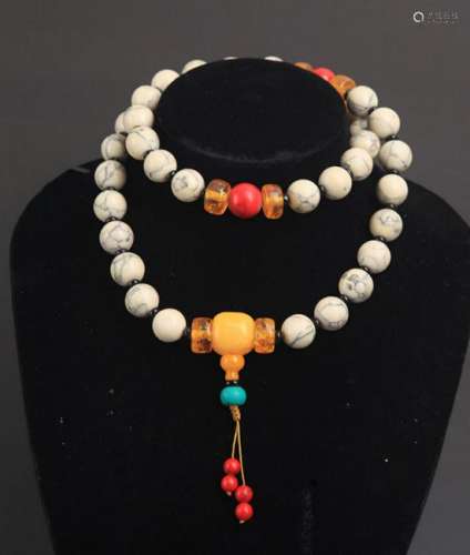 A FINE WHITE CORAL WITH AMBER NECKLACE