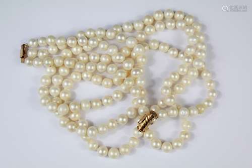 A Triple Strand Cultured Pearl Necklace