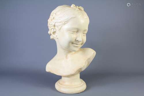 A Plaster Bust of a Girl with braided hair, approx 35 cms