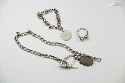 A Silver Bracelet with Tiffany NY medallion, dated 2009 together with a silver Gucci key-fob and a Tiffany & Co key fob (marks rubbed)