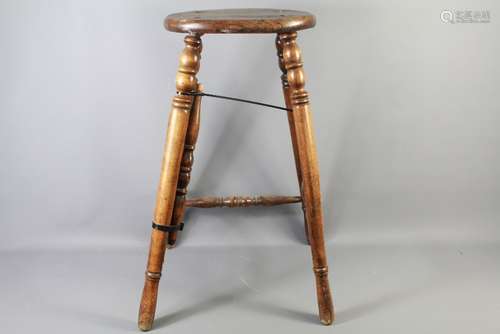 A 19th Century Mahogany Bar Stool, approx 75 cms h, with oval seat