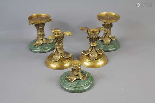 A Set of Four Elegant Classical-Style Candle Holders