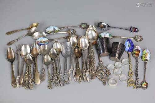 group of silver items (spoons, rings, etc.)