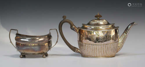 A George III silver oval half-reeded teapot, London 1800 by John Robins, height 16cm, together