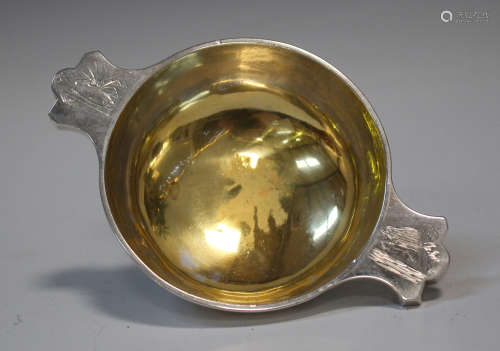 A Victorian Scottish silver quaich of circular form, flanked by a pair of tab handles, engraved with