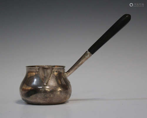 A George III silver brandy pan with faceted ebonized handle, London probably 1789 by Thomas Rowe,