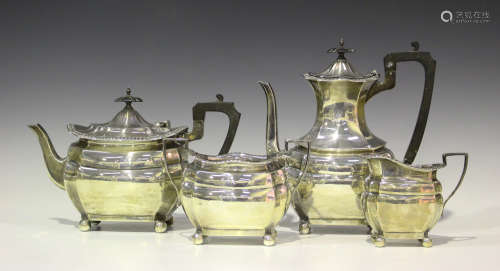 A George V silver four-piece tea set of lobed oval form with gadrooned rim, comprising teapot, hot