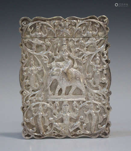 A late 19th century Indian silver card case, repoussé decorated and chased with deities and