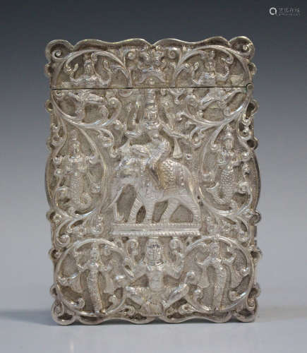 A late 19th century Indian silver card case, repoussé decorated and chased with deities and