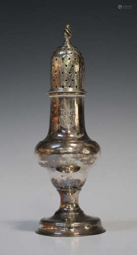 A George III silver pepper caster of ogee baluster form, the pierced dome cover with spiral