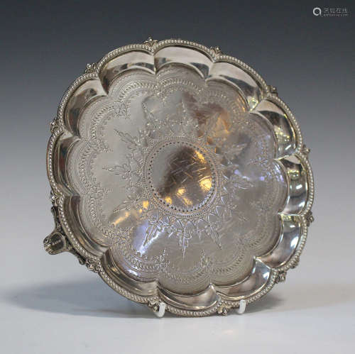 A Victorian silver circular card salver with engraved decoration within a petal and beaded raised