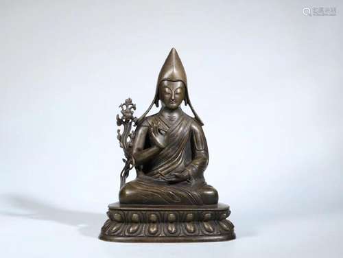 A TIBETAN GILT BRONZE CASTED RESPECTING BUDDHA