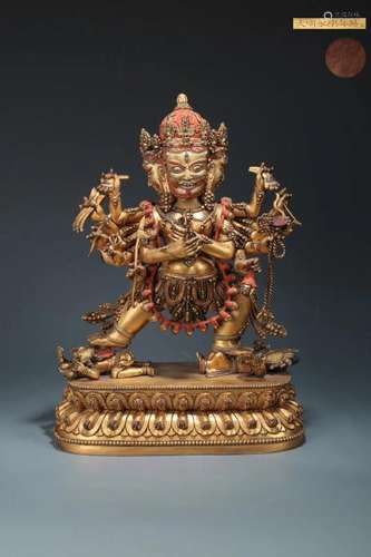 A GILT BRONZE MULTI-ARM BUDDHA