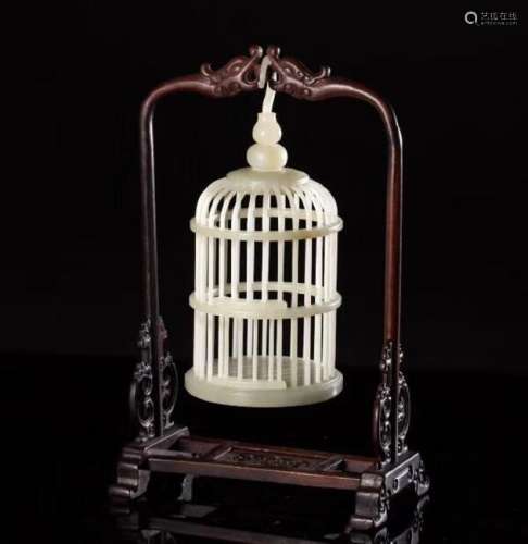 A HETIAN JADE CARVED CRICKET CAGE ORNAMENT