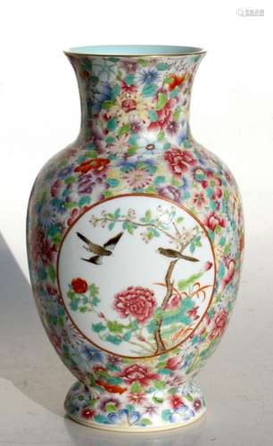 A Chinese millefiori vase decorated with birds and flowers within panels, red seal mark to