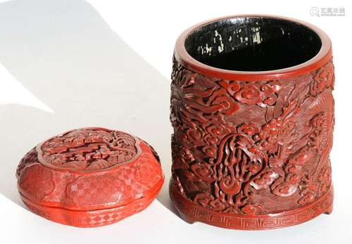 A Chinese cinnabar lacquer brush pot decorated with a dragon chasing a flaming pearl, 13cms (5ins)