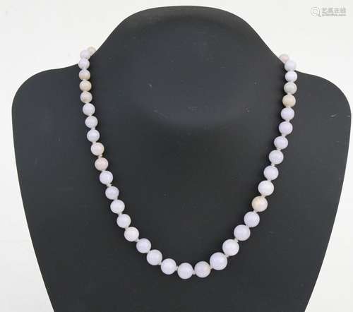 A lavender jade graduated bead necklace, the largest bead approx 10mm diameter, 48cms (19ins) long.