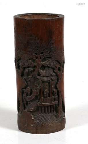 A Chinese bamboo brush pot carved with figures within a landscape, 29cms (11.5ins) high.