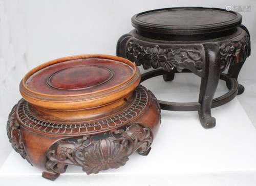 A large Chinese pierced hardwood vase stand, 27cms (10.5ins) high; together with another ebonised