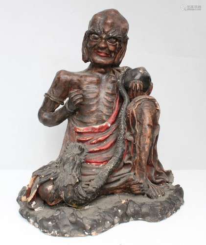 A 19th century Japanese polychromed figure of an emaciated monk with glass eyes, 25cms (9.75ins)