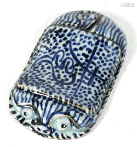 A Chinese blue & white wrist rest (possibly 18th / 19th century) in the form of a stylised tiger,